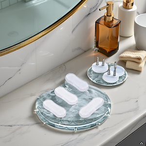 A bathroom vanity with a toilet in the background.