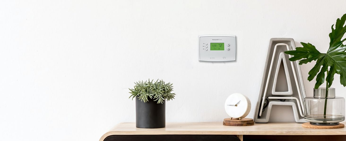 5-2 Day Programmable Thermostat above the living room furniture