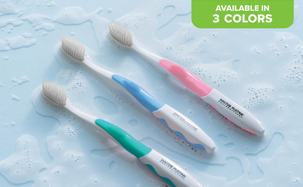 pink toothbrush blue toothbrush green toothbrush