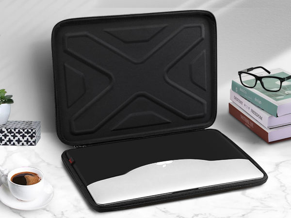 a laptop case with a laptop lid on a marble table.