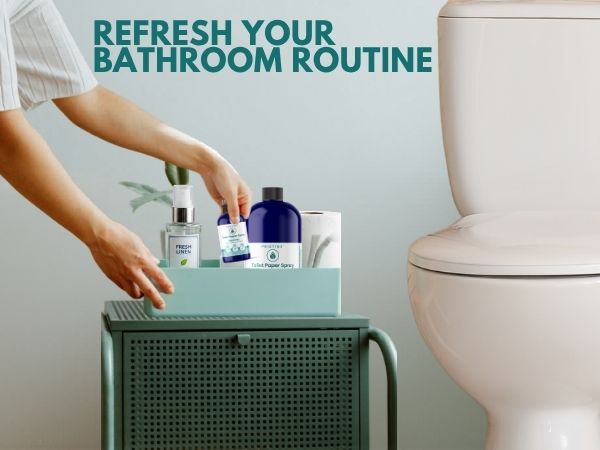 woman in bathroom placing pristine toilet paper spray wet wipe alternative next to toilet