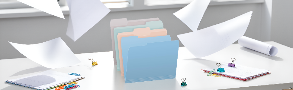 A clean, modern home office desk with an open filing cabinet drawer in the background, soft natural