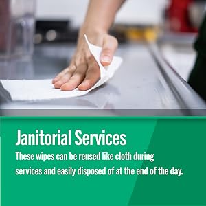 Foodservice Reusable Paper Towels in pink line pattern being used by a janitor to clean up a spill