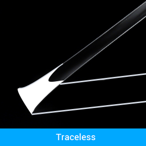 Close-up of sharp, pointed white objects against a black background. Text 'Traceless' in blue at the bottom.