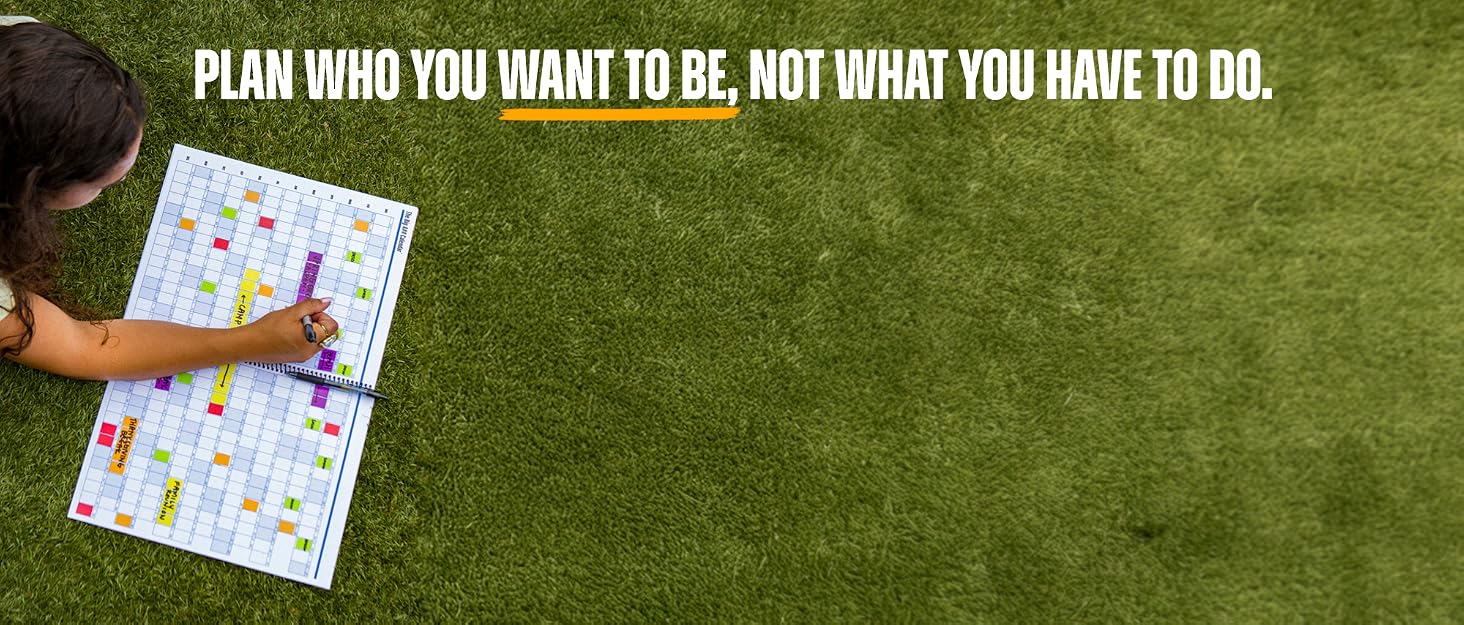 girl with planner on grass field