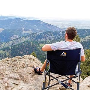 Man enjoying the view sitting on a GCI Outdoor chair
