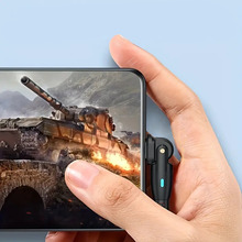 A person playing on the phone while charging