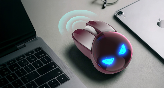 In-context lifestyle scene: the burgundy rabbit-shaped wireless mouse resting beside an open slim la