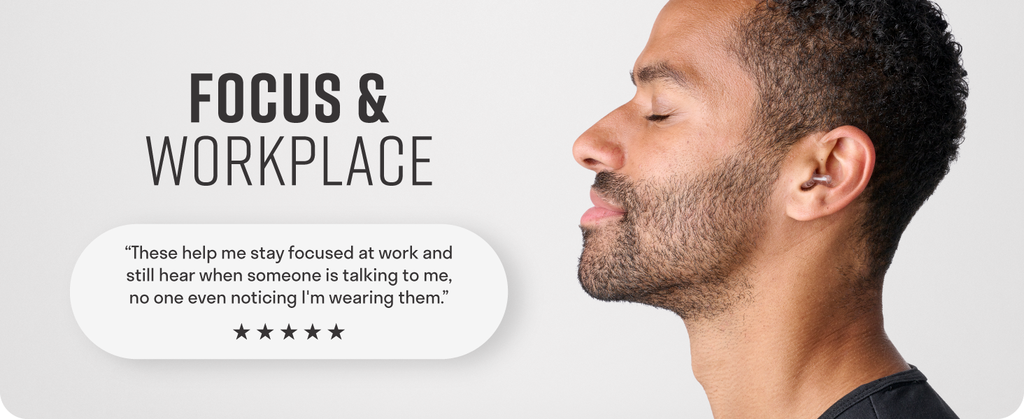 Man with peaceful and focused expression wearing invisible ear plugs to reduce noise