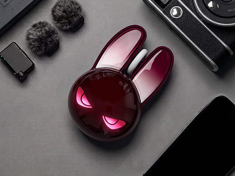 Close-up macro studio shot of the rabbit-shaped wireless mouse at a 45-degree angle, shot from sligh