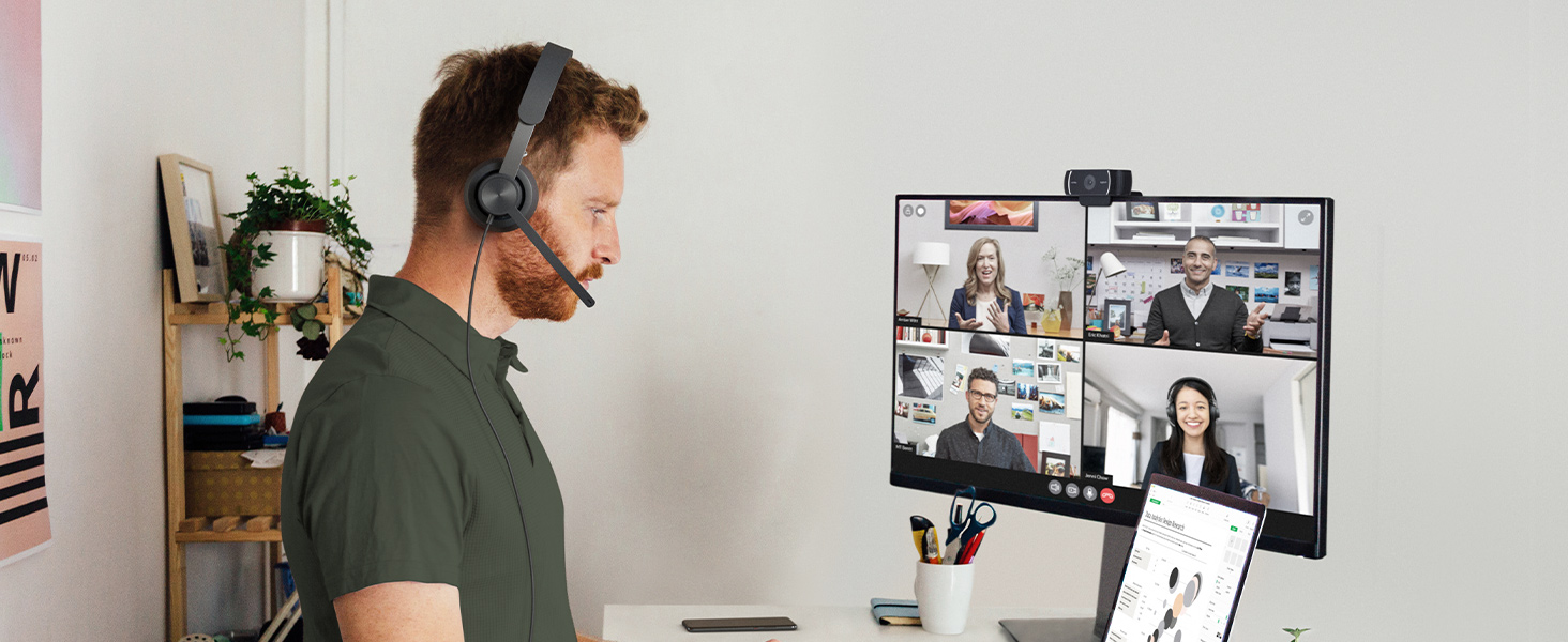 a man having a video call using zone 750 wired on-ear headset with noise-cancelling microphone