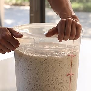 Woman opening 4quart translucent container with dough.