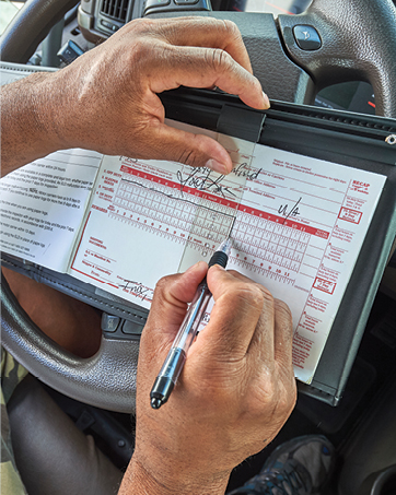 Filling out log form for trucking