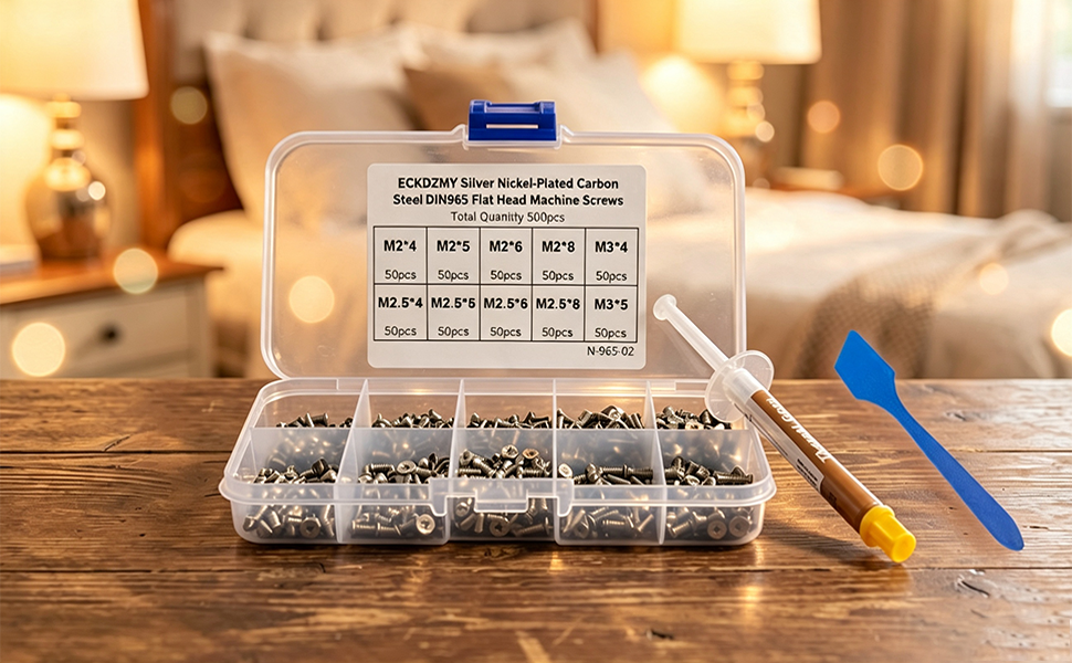 ECKDZMY 500pcs silver laptop screw kit with 1g thermal paste and blue spreader on wooden desk.