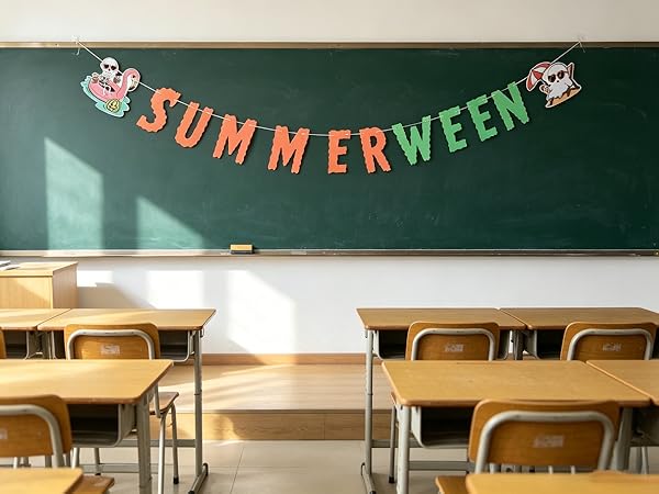 Spooky paper banner in classroom, pumpkins and ghosts.