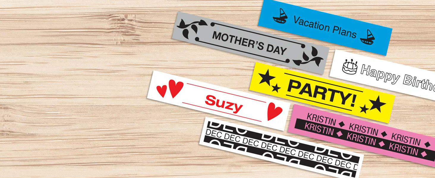 Different colored sample labels on a wood surface, with different fonts, symbols, and borders used