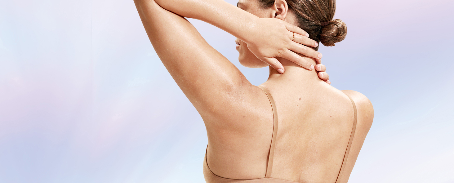 A woman touching her neck