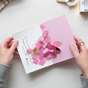 Handmade confetti made of pink and gold tissue paper for birthdays, graduations and bridal showers