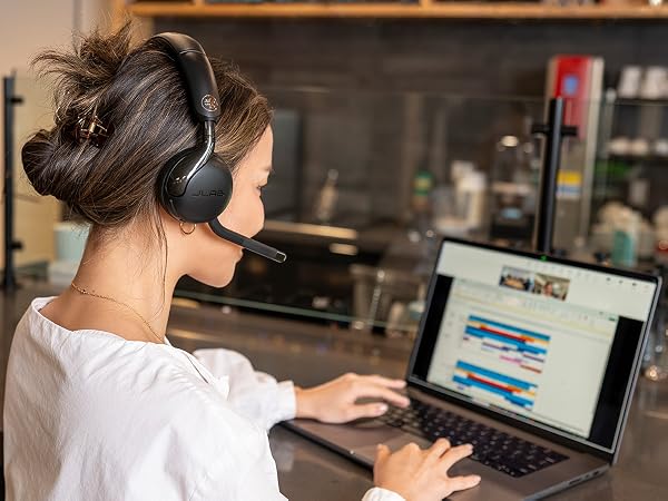 A woman taking a teams call with the go work 3 headset