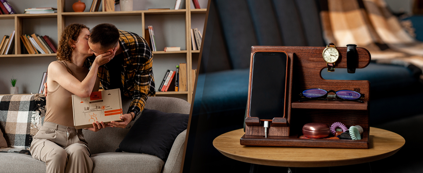Wooden desk organizer with smartphone stand, watch holder, and small storage compartments, displayed on round wooden table.