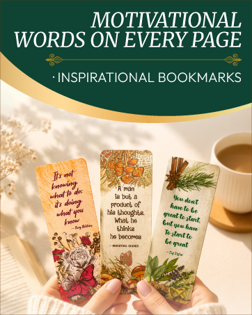 Inspirational bookmarks with motivational quotes held over an open book beside a cup of tea.