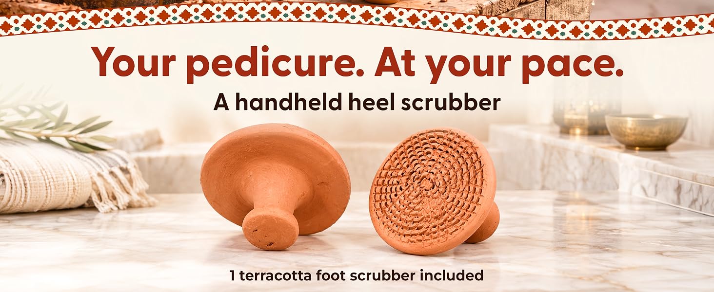Front and back views of a terracotta heel scrubber on a bathroom counter; one scrubber included