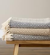 double diamond throw blankets neatly folded in a pile
