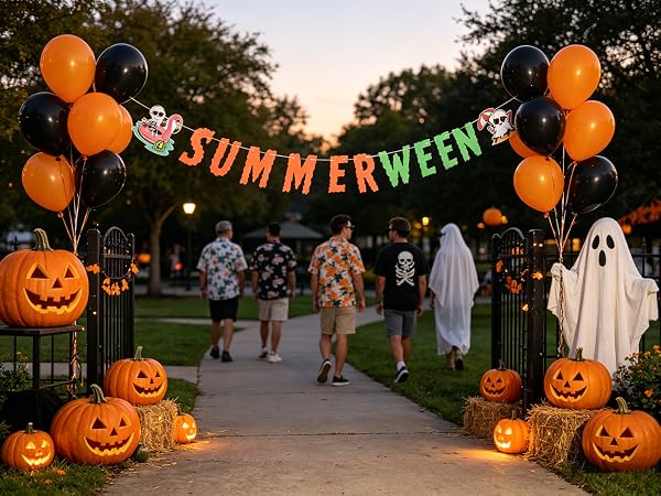 Outdoor banner with watermelon faces, festive neighborhood party.
