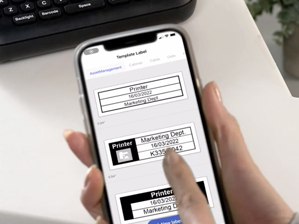 Person using iPrint&Label app on mobile device to select pre-built label template with table layout