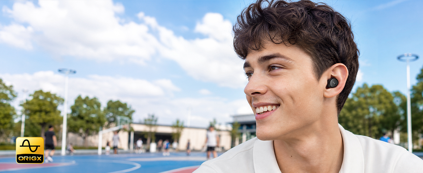Person wearing TOZO A1 earbuds in everyday outdoor setting with OrigX tuned sound