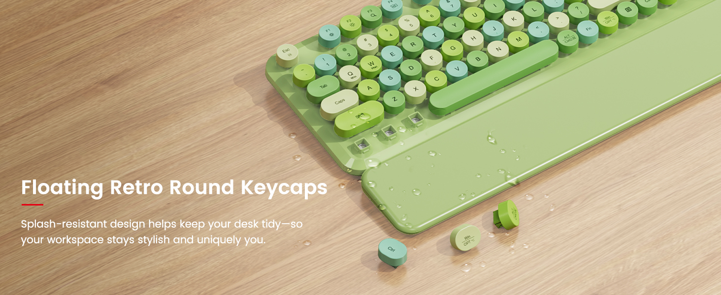 Close-up of green round keycaps and wrist rest with removable keys and splash-resistant design