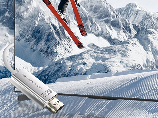 USB flash drive shown against snowy mountain backdrop with ski equipment visible, highlighting portable data storage device.