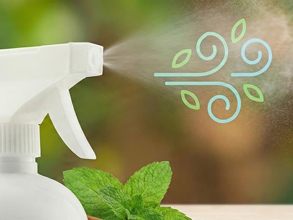 Close-up focusing on the spray mist coming out of the nozzle. graphic icon of a "Fresh Air" swirl.
