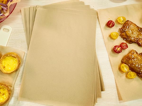 Birds-eye view of prepared food items on a light-colored surface, including what appears to be baked or grilled items with garnishes.