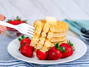 Fork with bite of pancake on it.