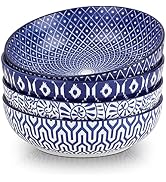 Set of four stacked ceramic bowls with blue and white patterns. Each bowl features a different intricate design, including geometric shapes and floral motifs.