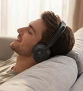Black over-ear Bluetooth headset with mic, man relaxing on sofa with wireless headphones music