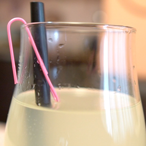 Paper clips used as straw holder that safes straw from falling into glass of juice