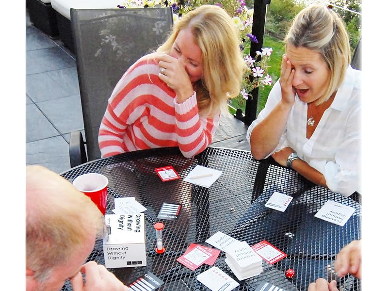 Adults at a table with the game spread out