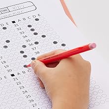 Red barrel pencil filling in test answers