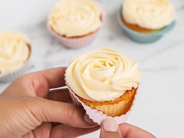 Dusty rose and dusty blue silicone baking cups with a cupcake