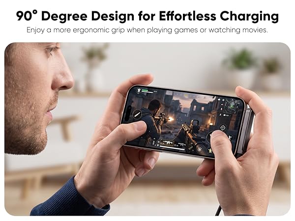 Text reads '90° Degree Design for Effortless Charging. Enjoy a more ergonomic grip when playing games or watching movies.' Hands holding smartphone in gaming position against blurred background.