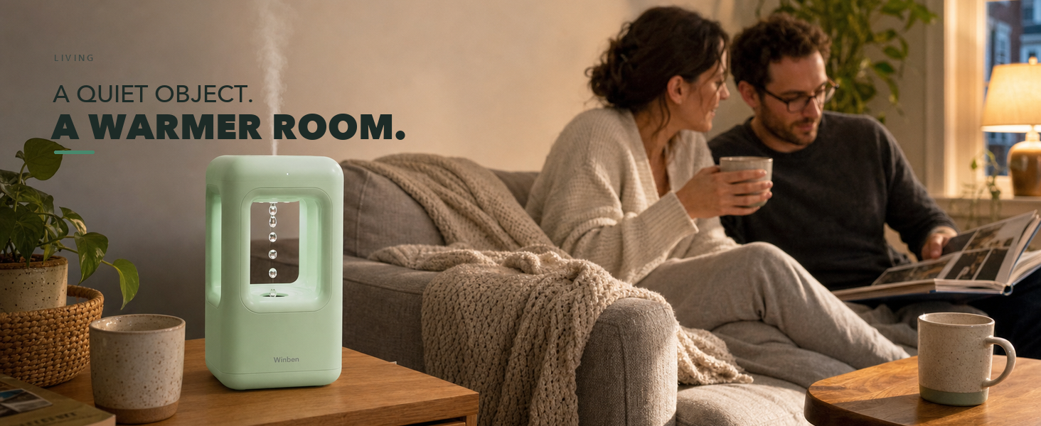 WINBEN green cool mist humidifier running on a side table in a contemporary living room