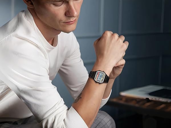 Black square digital watch on wrist, retro metal digital watch for work and casual outfits