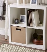 Taupe storage cube in shelf unit