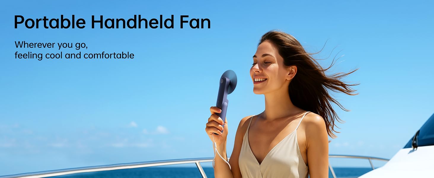 Text reads "Portable Handheld Fan" and "Whisper-quiet, go-on, hand-held portable". Woman outdoors holding blue handheld fan against bright sky.