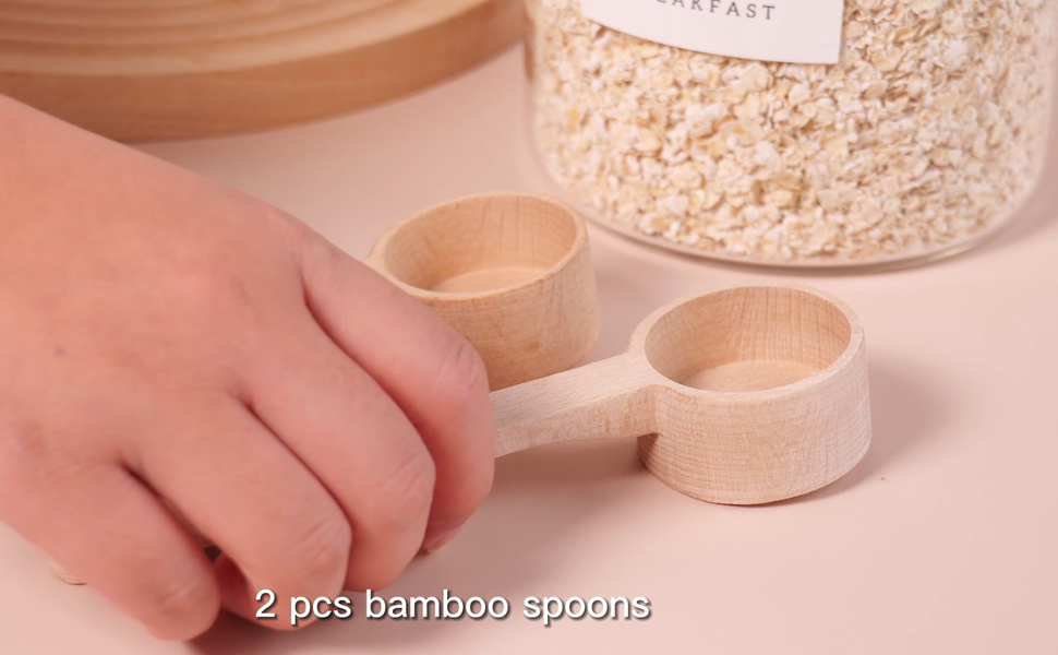 Glass canisters with airtight lids with two wooden spoons