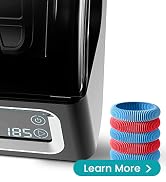 a black coffee maker with a stack of colorful plastic rings.