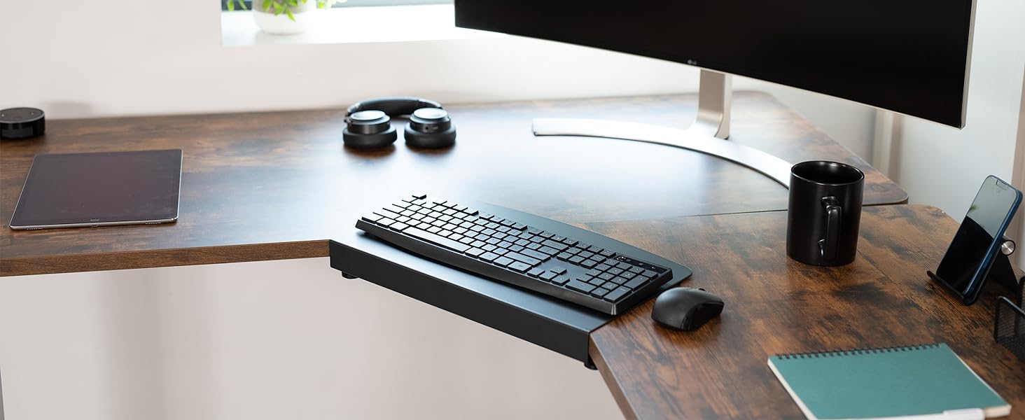 Corner desk setup with keyboard