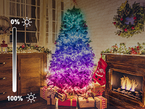 Artificial Christmas tree with ombre color effect from blue to purple to pink, displayed near fireplace with presents. Brightness adjustment scale shown.